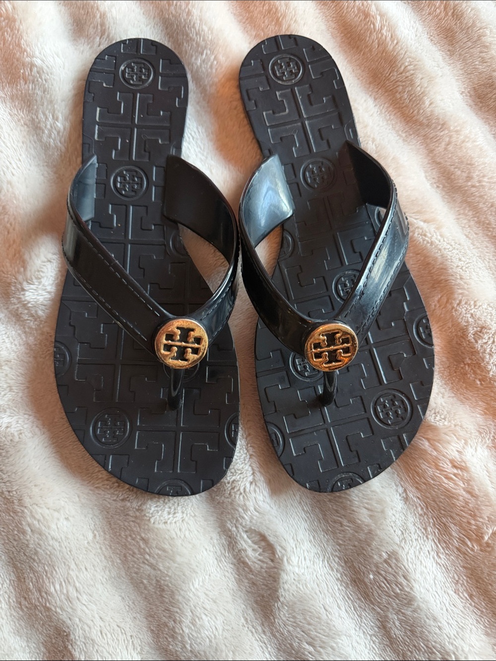 Tory Burch Thora Black Flip Flops with Gold Logo Medallion